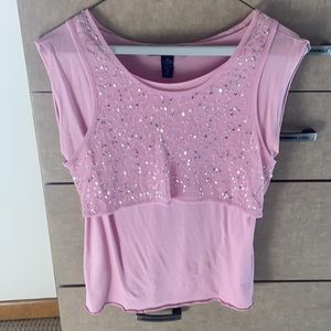 Light pink sleeveless top with sequined sheer overlay.